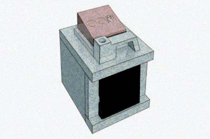 イラスト:直方体のお墓。上部に家名を刻んだプレートがついています。